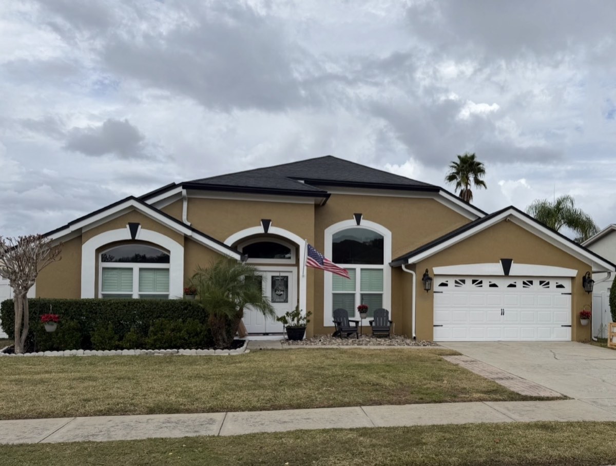 Freshly painted single-story Winter Springs home with warm gold walls and crisp white trim